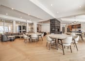 Thumbnail 38 of 39 - A modern dining room with a large table surrounded by chairs.