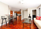 Thumbnail 10 of 20 - a living room with a couch and a table