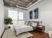 Thumbnail 6 of 17 - a bedroom with a bed and a large window at 150 Marketplace, Ontario, K2J 5R5