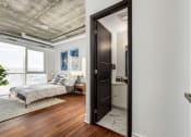 Thumbnail 3 of 17 - a bedroom with a bed and a window at 150 Marketplace, Ottawa, Ontario