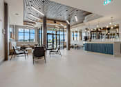 Thumbnail 31 of 34 - A modern interior with a bar and seating area at The Woods at 180 Kanata Avenue Apartments, Kanata, ON