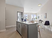 Thumbnail 11 of 24 - A kitchen with a refrigerator, oven, and sink at The Woods at 180 Kanata Avenue, Kanata, ON