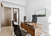 Thumbnail 6 of 24 - A room with a desk and a chair at The Woods at 180 Kanata Avenue, Kanata, Ontario, K2K 3L9