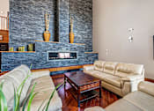 Thumbnail 16 of 18 - a living room with leather furniture and a fireplace