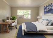 Thumbnail 5 of 12 - a bedroom with a bed and a desk with a computer at North Washington Apartments