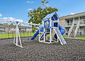 Thumbnail 53 of 55 - A playground with a blue and white play structure and a slide.