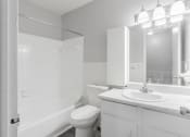 Thumbnail 13 of 18 - a bathroom with a sink toilet and bathtub