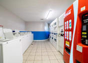 Thumbnail 11 of 13 - A Coca-Cola vending machine is on the right.