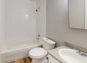 Thumbnail 7 of 17 - a bathroom with a toilet sink and bathtub