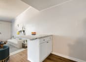 Thumbnail 2 of 9 - a view of the kitchen and living room in a 555 waverly unit
