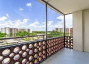 Thumbnail 19 of 33 - a balcony with a view of the city and trees at Fairways of Inverrary, Lauderhill, 33319