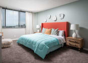 Thumbnail 13 of 33 - a bedroom with a bed with a blue comforter at Fairways of Inverrary, Lauderhill, FL