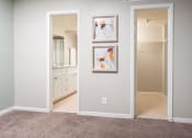 Thumbnail 16 of 33 - a bathroom with a mirror and two pictures on the wall at Fairways of Inverrary, Lauderhill, FL, 33319