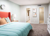 Thumbnail 14 of 33 - a bedroom with a bed and a closet at Fairways of Inverrary, Florida