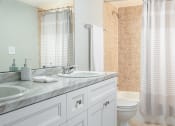 Thumbnail 18 of 33 - a bathroom with a sink and a toilet and a shower at Fairways of Inverrary, Lauderhill, FL, 33319