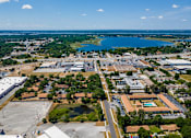 Thumbnail 21 of 21 - A large industrial area with a lake in the distance.