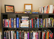 Thumbnail 8 of 16 - a bookcase filled with books and a bunch of books