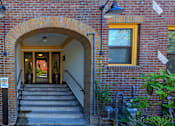 Thumbnail 2 of 16 - a brick building with an arched doorway