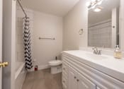 Thumbnail 34 of 64 - a bathroom with a sink and a toilet
