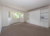 Thumbnail 41 of 64 - a bedroom with white walls and carpet