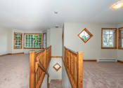 Thumbnail 10 of 64 - a large living room with a staircase leading up to the second floor
