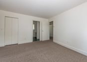 Thumbnail 45 of 64 - a bedroom with white walls and carpet