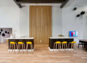 Thumbnail 11 of 95 - a clubhouse room with chairs and a table at Presidio Palms Apartments, Tucson, 85701