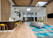 Thumbnail 5 of 95 - Lobby area with a couch and television at Presidio Palms Apartments, Arizona , 85701