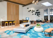 Thumbnail 8 of 95 - Lobby area with a couch and a bar at Presidio Palms Apartments, Tucson, AZ, 85701