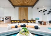 Thumbnail 44 of 95 - the lobby or reception area of a hotel with couches and tables at Presidio Palms Apartments, Arizona, 85701