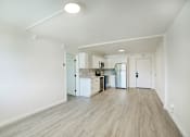 Thumbnail 92 of 95 - A kitchen area with a refrigerator, sink, and ovenat Presidio Palms Apartments, Tucson, AZ