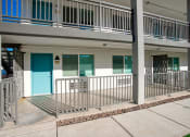 Thumbnail 20 of 95 - the front of a building with a porch  at Presidio Palms Apartments, Tucson, AZ, Arizona