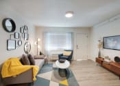 Thumbnail 21 of 95 - a living room with a couch and a tv at Presidio Palms Apartments, Arizona , 85701
