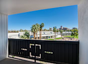 Thumbnail 71 of 95 - A balcony overlooking the city skyline at Presidio Palms Apartments, Tucson