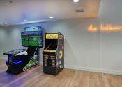 Thumbnail 66 of 95 - a games room with video games and a video game system at Presidio Palms Apartments, Tucson, Arizona
