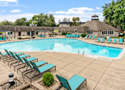 Thumbnail 14 of 25 - large outdoor pool with lounge chairs