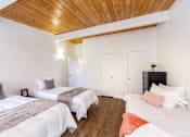 Thumbnail 26 of 28 - A furnished bedroom at The Wave