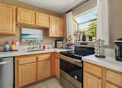 Thumbnail 3 of 33 - Clubhouse kitchen with complimentary coffee bar