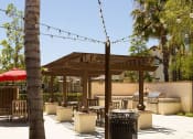 Thumbnail 11 of 38 - a patio area with BBQ grill and string lights