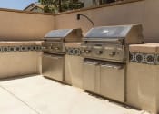 Thumbnail 9 of 38 - a barbecue grill area outside