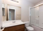 Thumbnail 36 of 38 - a bathroom with toilet, sink, and tub/shower