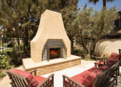 Thumbnail 12 of 38 - a fire place and patio area outside