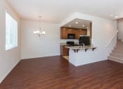 Thumbnail 26 of 38 - living room and kitchen