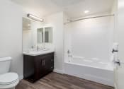Thumbnail 21 of 25 - a bathroom with a toilet sink and bathtub