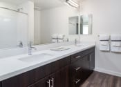 Thumbnail 20 of 25 - a bathroom with two sinks and a mirror