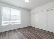 Thumbnail 18 of 25 - bedroom with large window and closet