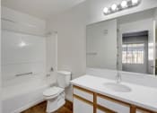 Thumbnail 42 of 61 - a bathroom with a toilet sink and bathtub