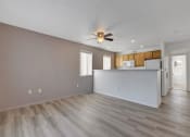 Thumbnail 46 of 61 - an empty living room with a ceiling fan