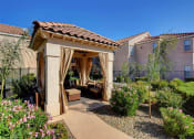 Thumbnail 16 of 61 - a gazebo with curtains in a garden