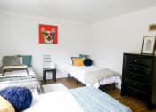 Thumbnail 10 of 46 - a bedroom with three beds